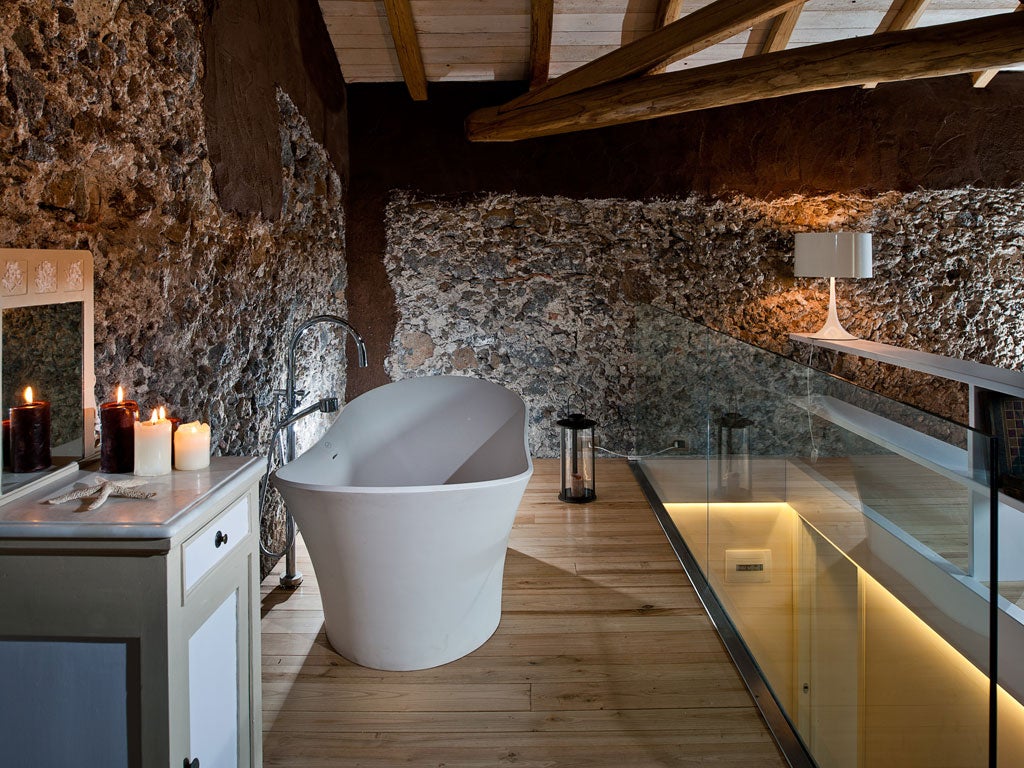 The Monaci delle Terre Nere is a newly converted villa on an organic farm below Mount Etna. It has six sumptuous rooms, orange groves outside and open fires within. Doubles €150, B&B (monacidelleterrenere.it).