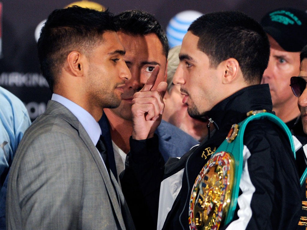 Amir Khan will attempt to take Danny Garcia's WBC light-welterweight belt in Las Vegas tonight