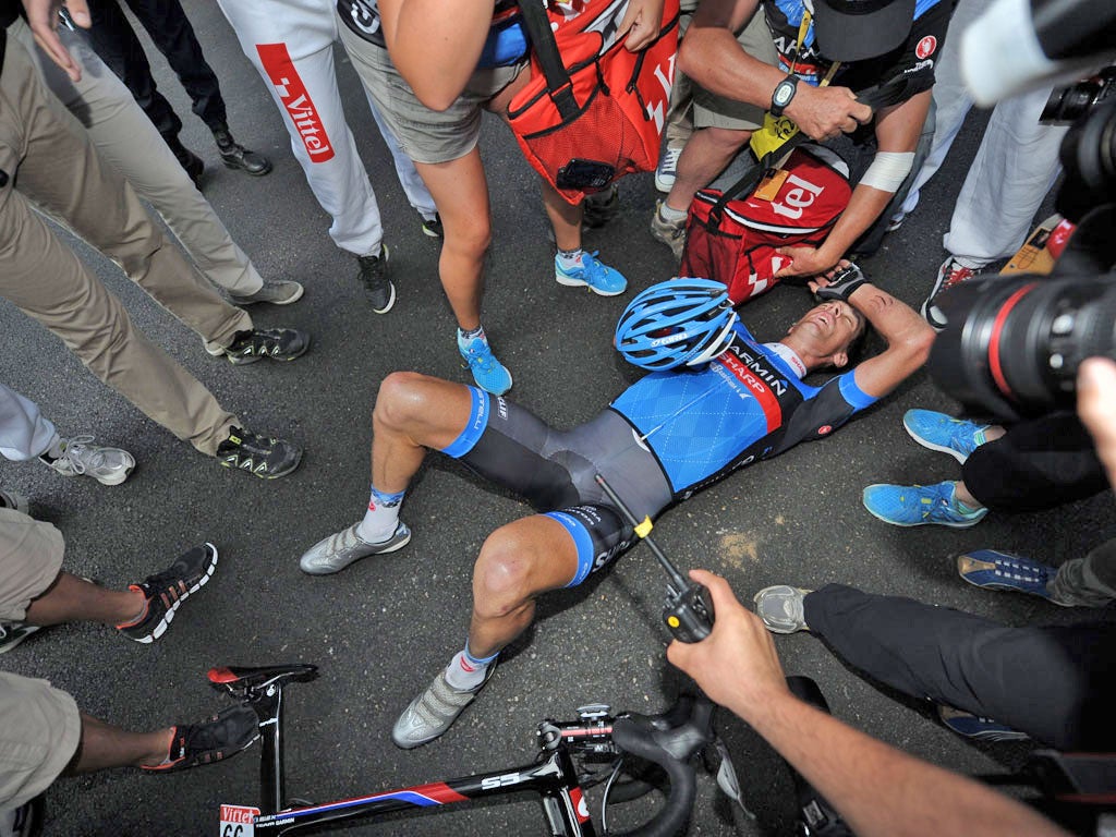 David Millar collapses to the ground after his stage win yesterday