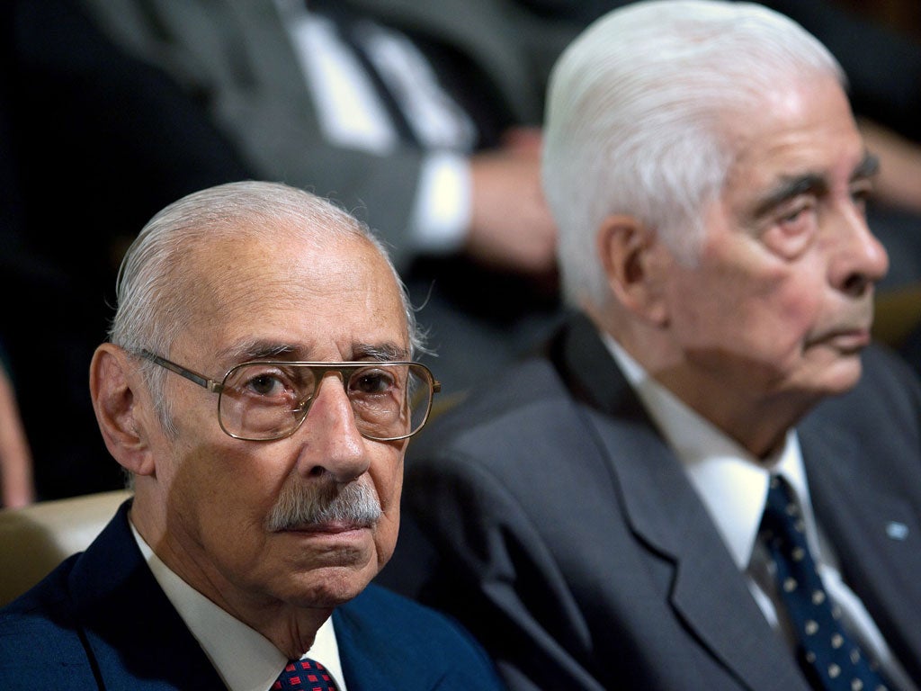 Former Argentine general and dictator (1976-81) Jorge Rafael Videla (left) and former army general Luciano Benjamin Menendezawait