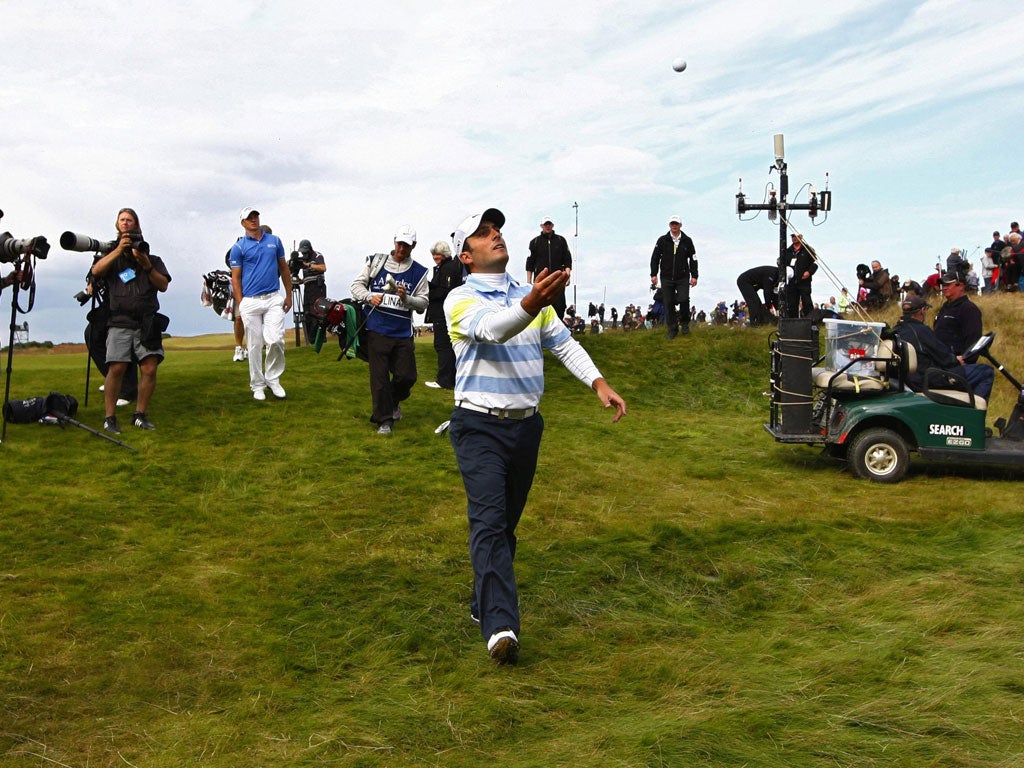 Francesco Molinari throws his ball to the crowd after taking a 17-under-par, one-shot lead into today's final round of the Scottish  Open at Castle Stuart