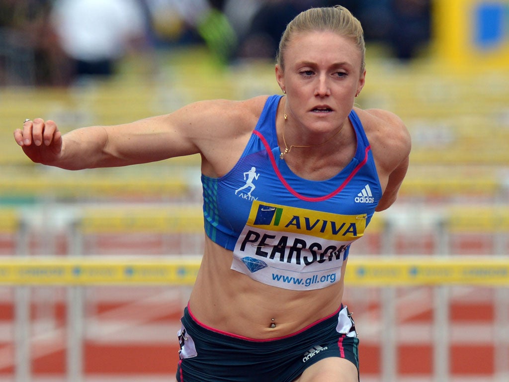 Close-run thing: Sally Pearson holds off Kellie Wells in the heats in London, but she lost to the American in the final