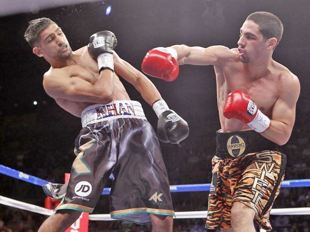 Danny Garcia connects with a right hand while Amir Khan is out for the count