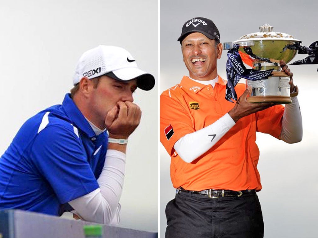 Warren, left, is dejected as Jeev Milkha Singh lifts the Scottish Open