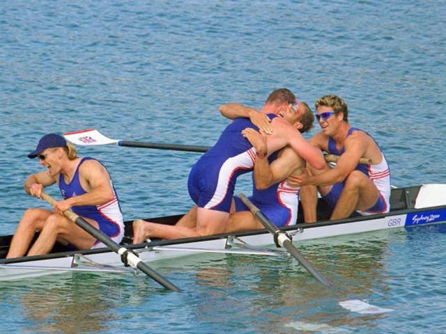 Matthew Pinsent hugs Steve Redgrave after victory