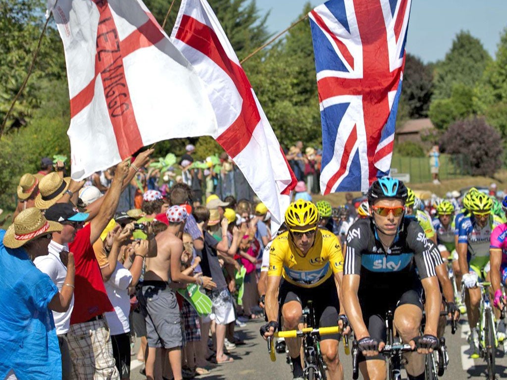 Tour de force: British fans cheer on Bradley Wiggins (yellow jersey)