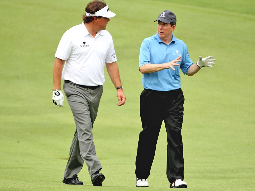 Phil Mickelson and disgraced banker Bob Diamond talk together during a pro-am before last year’s Barclays Singapore Open