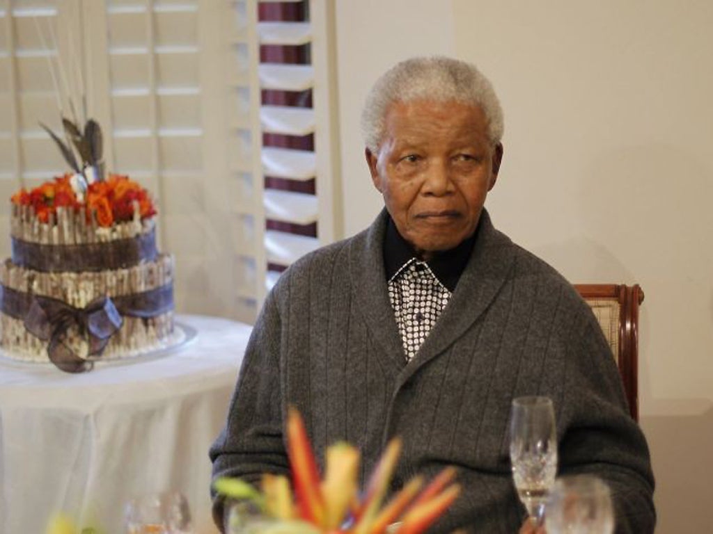 Nelson Mandela looks celebrates his birthday at his house in Eastern Cape with giant cakes and mass renditions of 'Happy Birthday'