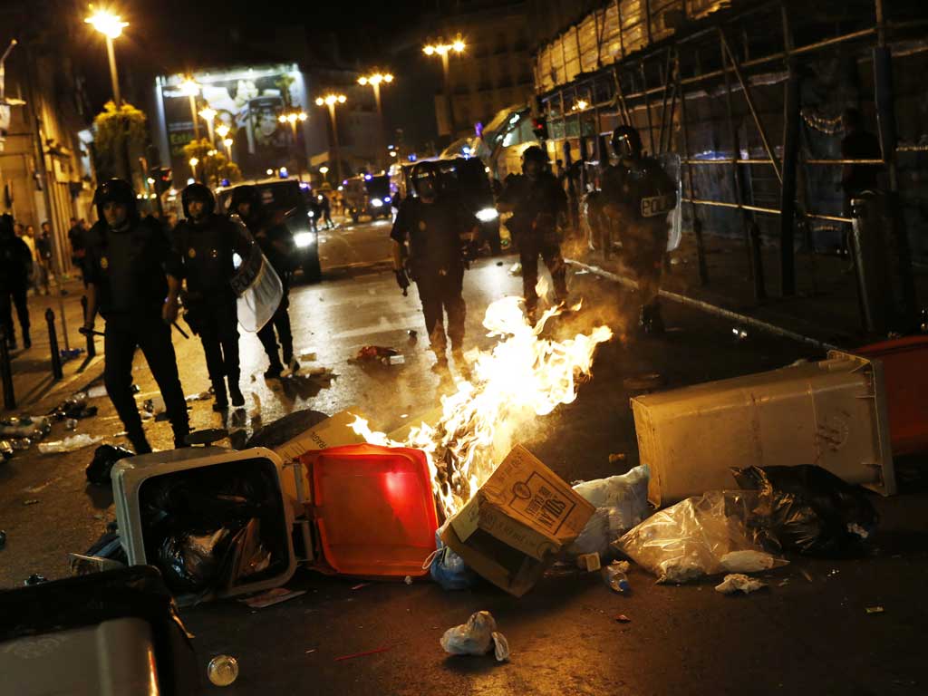 Police fired rubber bullets to disperse groups of protesters in Madrid