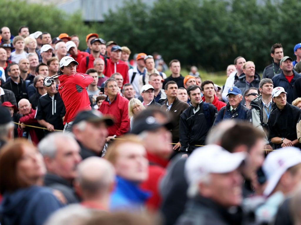 Rory McIlroy watches his tee shot on the 14th hole during yesterday's second round