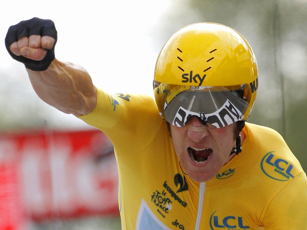 Wiggins celebrating on the finish line at the end of the 53,5 km individual time-trial