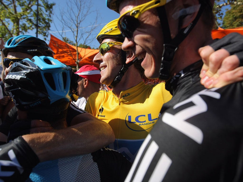 Bradley Wiggins celebrates with his team