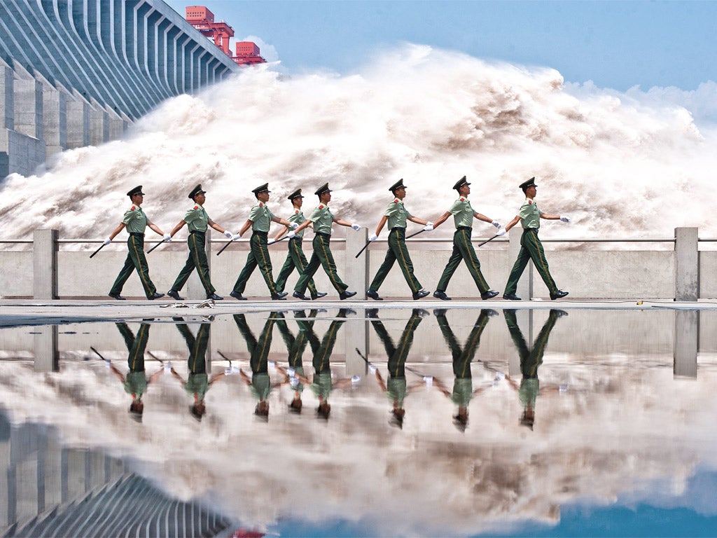 Armed police patrol at the Three Gorges Dam yesterday