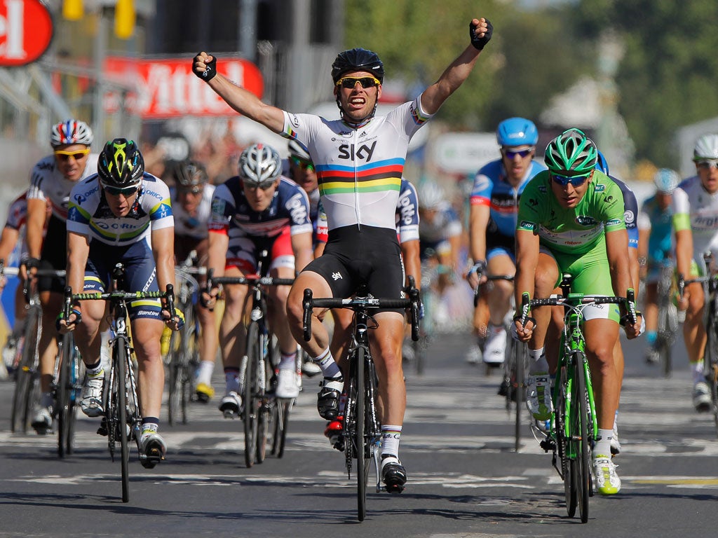 Mark Cavendish celebrates winning the final stage of the Tour de France