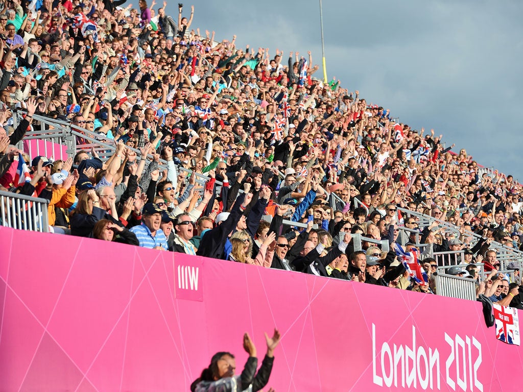 Spectators watch the hockey match between Great Britain and Japan