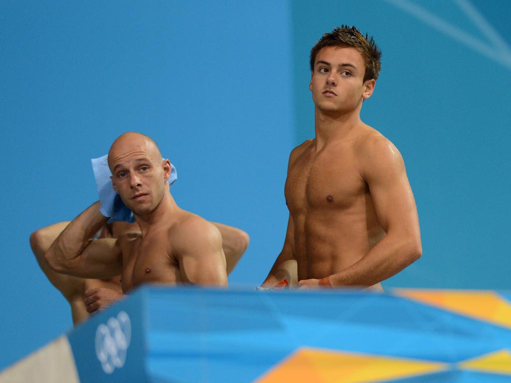 July 30, 2012: Tom Daley and Pete Waterfield look on as they finish fourth in the synchronized event