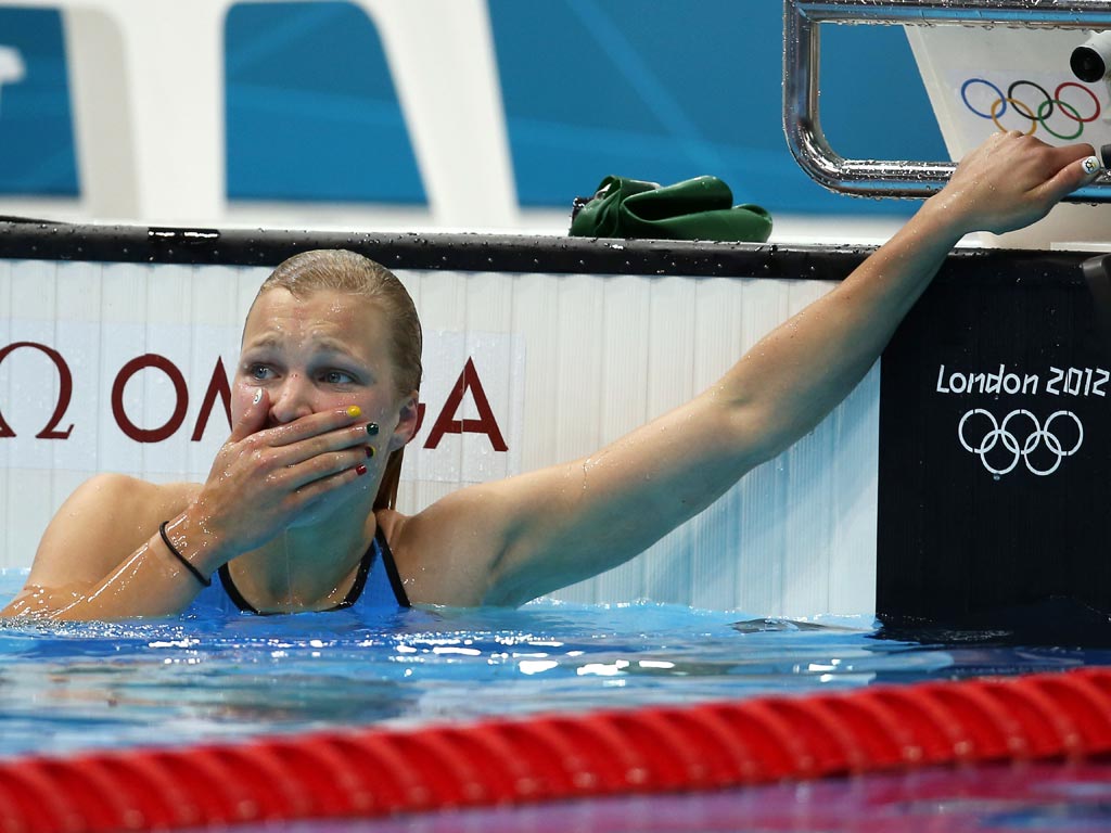 July 30, 2012: 15-year-old Ruta Meilutyte of Lithuania reacts after winning the final of the Women's 100m Breaststroke on Day 3 of the London 2012 Olympic Games at the Aquatics Centre