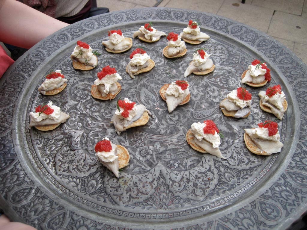 Buckwheat blinis with sweet herring, horseradish, salmon roe.
