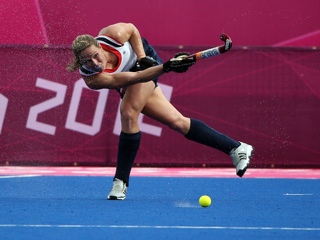 Crista Cullen of Great Britain clears the ball during the Women's Hockey Match between Great Britain and Korea