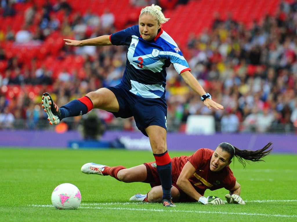 Steph Houghton skips over the Australian keeper before scoring the winning goal for Great Britain against Brazil