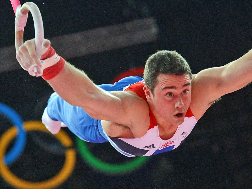 Kristian Thomas performs like Superman on the rings