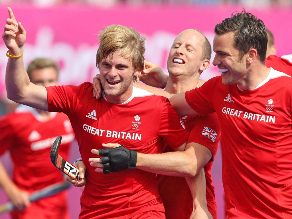 Ashley Jackson (left) celebrates his opening goal for Great Britain