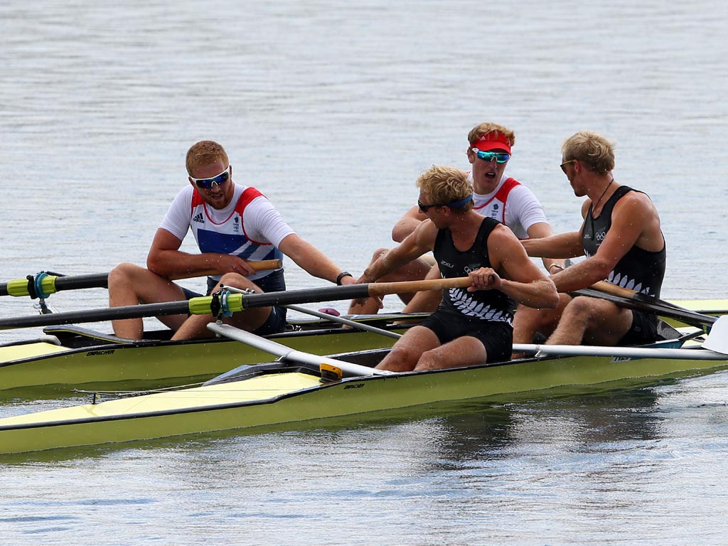 August 3, 2012: Hamish Bond and Eric Murray of New Zealand are congratulated by William Satch and George Nash of Great Britain as they celebrate winning gold in the Men's Pair final