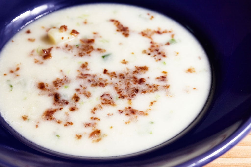 New potato soup with cumin and crispy bacon