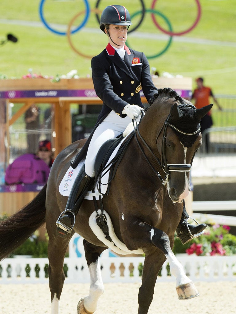 Charlotte Dujardin put Great Britain in team gold medal position and smashed an Olympic record