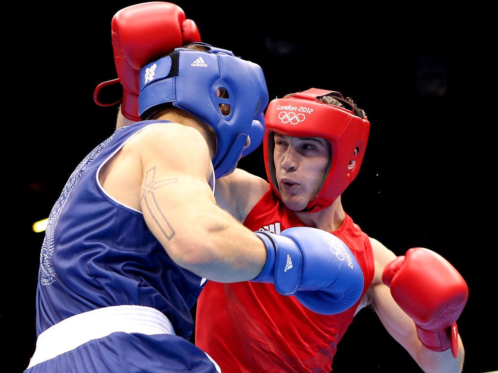 Fred Evans (right) takes the fight to Egidijus Kavaliauskas