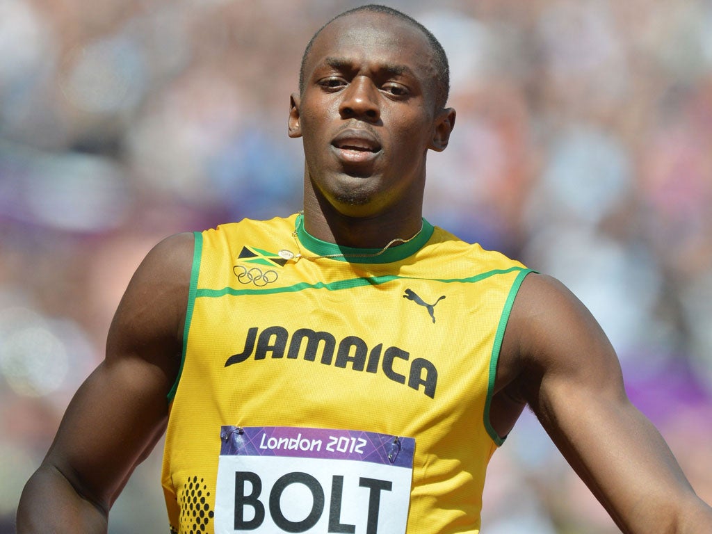 Usain Bolt wins his 100m heat in 10.08 seconds