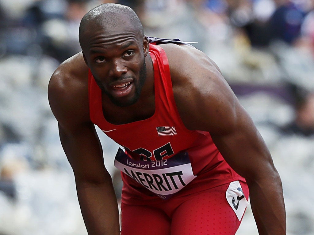 The heat is off: LaShawn Merritt treats his injured left leg after failing to finish the opening heat of his defence of the men's 400m title he won in 2008