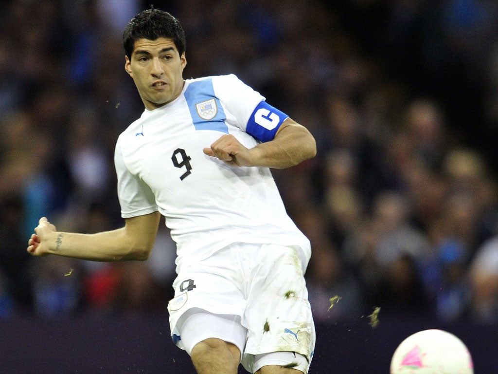Brendan Rodgers, has urged the striker Luis Suarez (pictured) to put his troubles of last season behind him