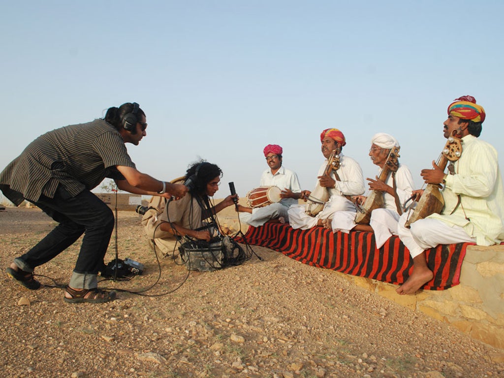 Men of kamancha: Ashu Sharma (crouching) and Ankur Malhotra (seated with microphone) record Sakar Khan (second from right) and his sons Darra, Ghewar and Feroz Khan playing 'The Train' in Hamira