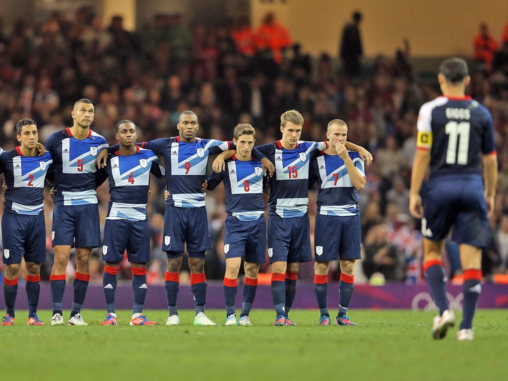 Ryan Giggs walks back after scoring his penalty in the shoot out