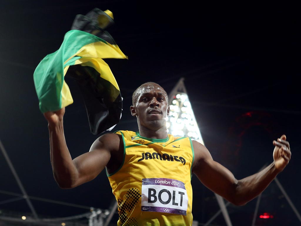 Usain Bolt celebrates his 100 metres victory