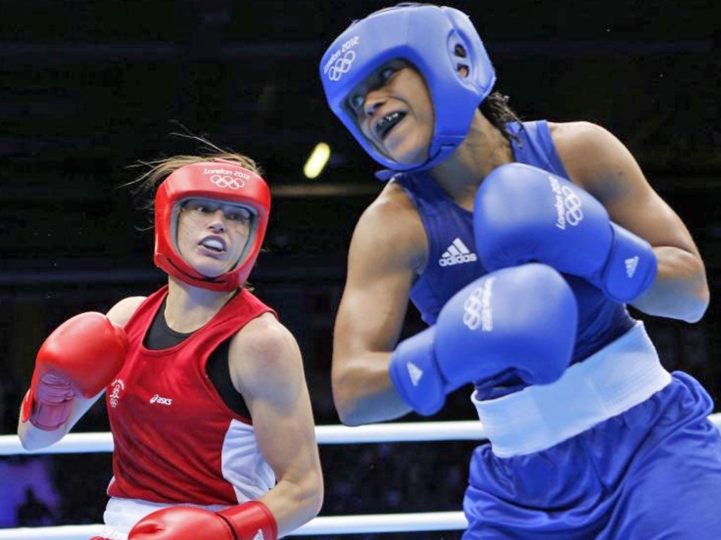 Katie Taylor, in red, beat GB’s Natasha Jonas