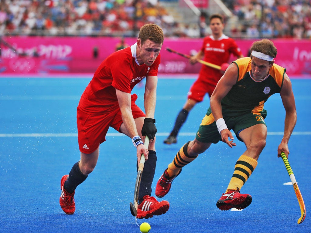 Team GB's forward Jonty Clarke (left)