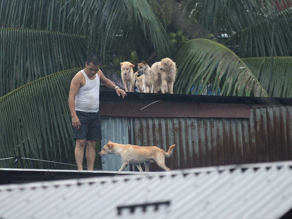 Deadly torrential rains submerged much of the Philippine capital and surrounding areas today