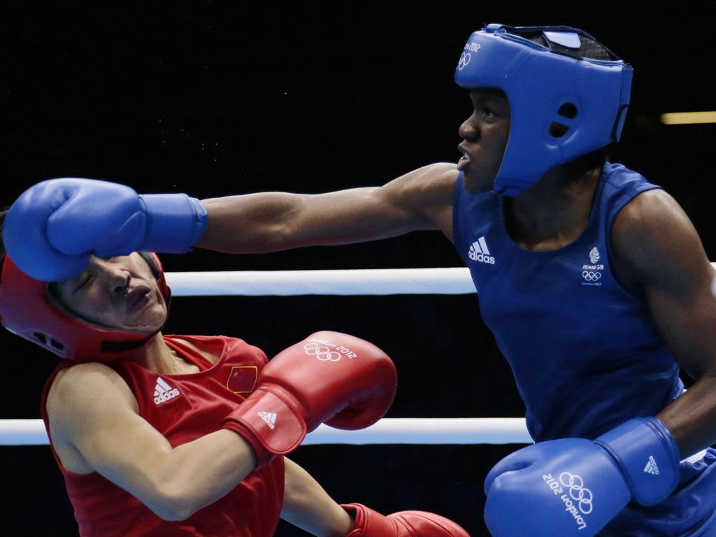 Nicola Adams sends Ren Cancan crashing to the canvas in the -51kg final yesterday