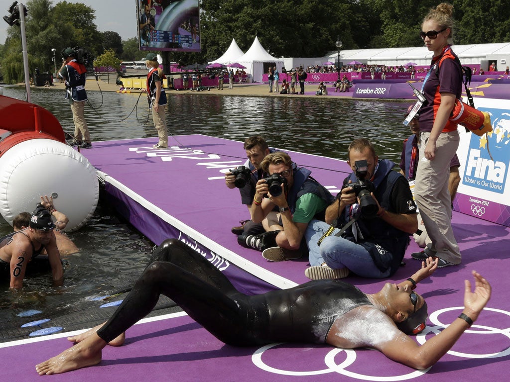 Tunisia's Oussama Mellouli catches his breath after winning gold