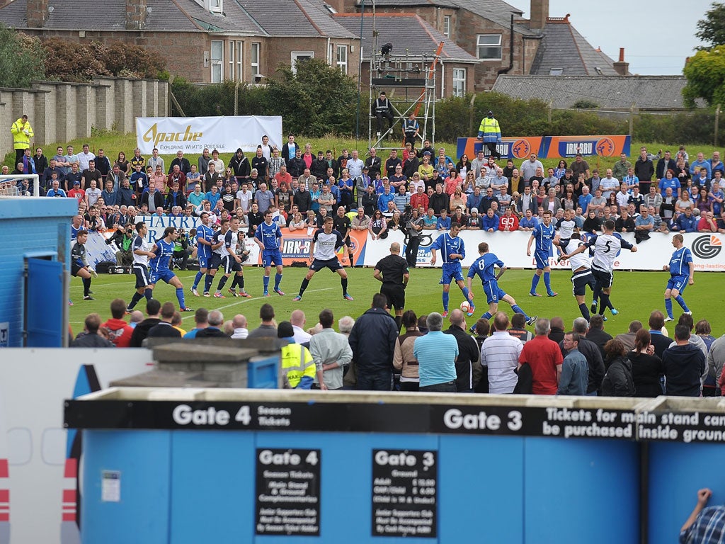 Open house: Rangers began the new season in the exposed surroundings of Peterhead's Balmoor Stadium