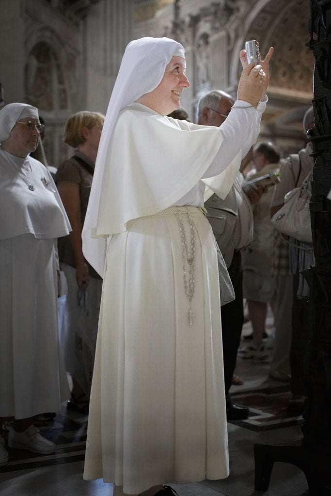 Habit of a lifetime: This nun at St Peter's Basilica caught Alan Powdrill's eye in the Vatican, Italy