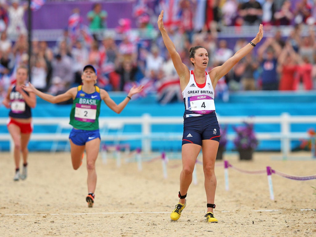August 12, 2012: Samantha Murray celebrates as she crosses the finish line during the women's m modern pentathlon