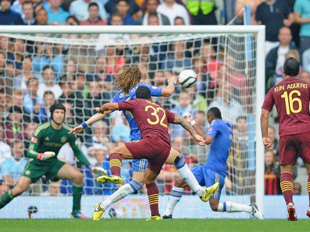 Carlos Tevez fires his superb goal past a helpless Petr Cech