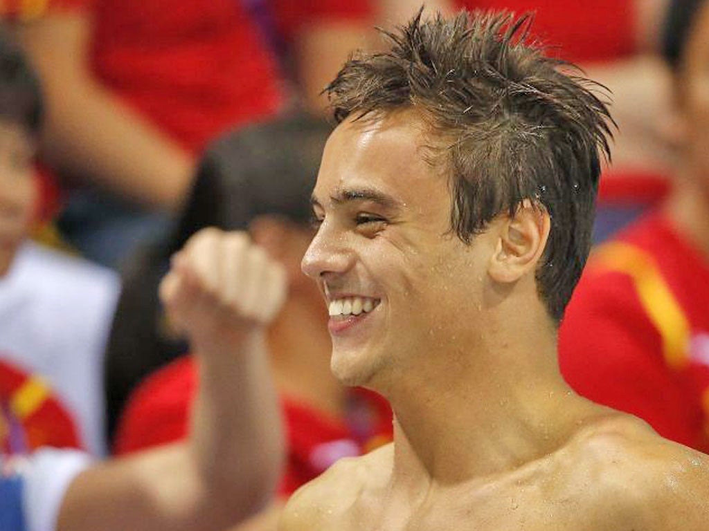 Tom Daley: In need of a sugar rush on Saturday, he ate some pick
and mix from a volunteer