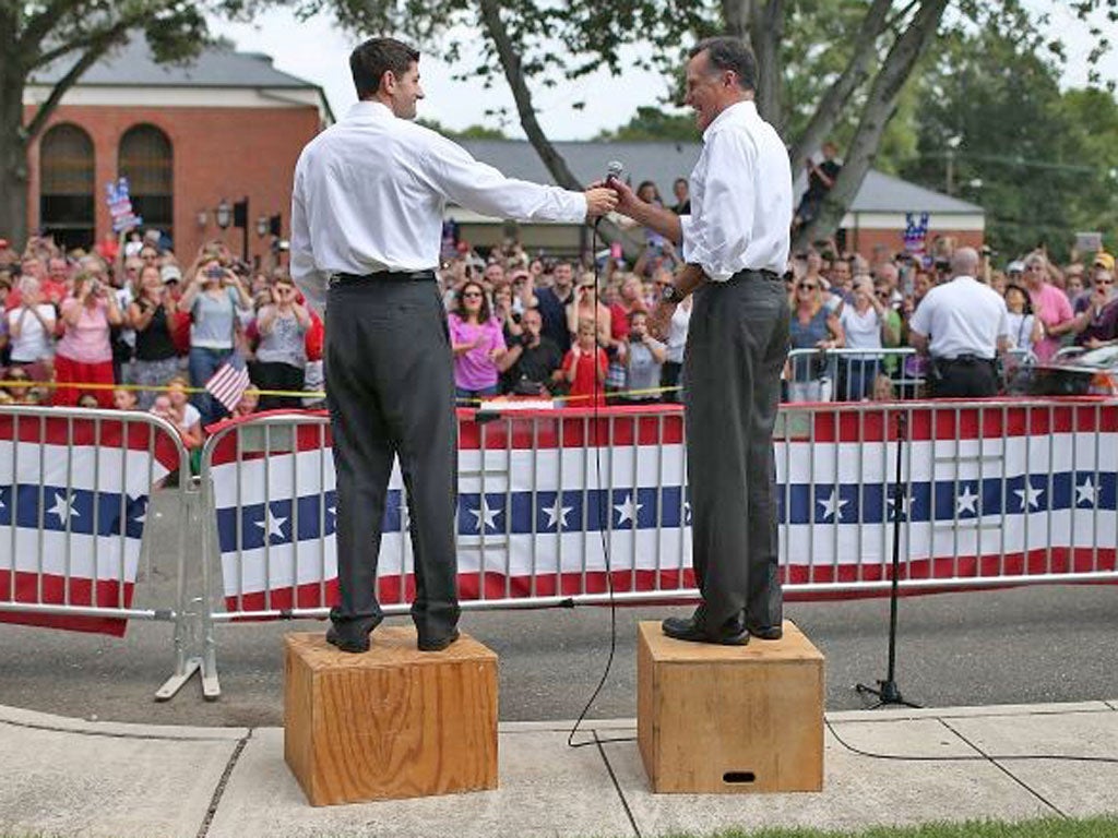 Boxing clever: Paul Ryan, left, and Mitt Romney at a rally in Ashland, Virginia, yesterday. They promise to rebuild America