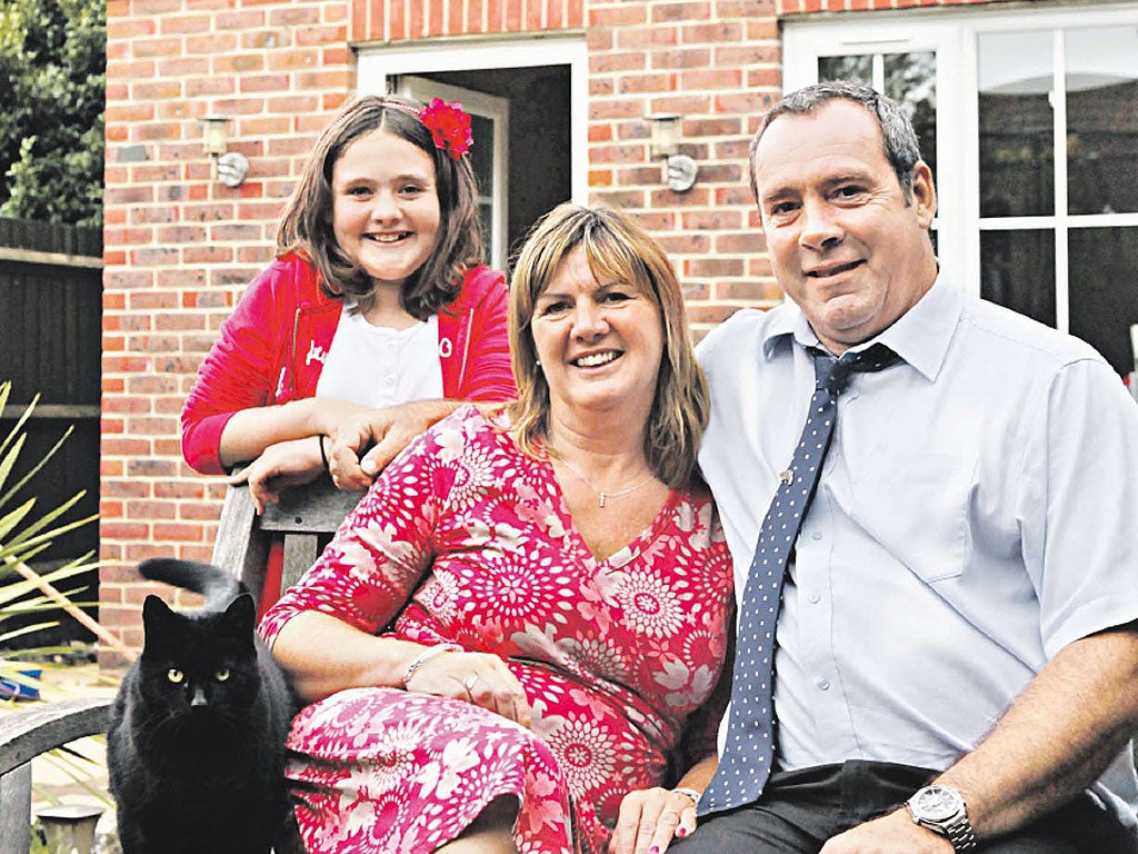 Alive and kicking: Andy Goode, who now raises money for pancreatic cancer research, with his wife Kate and daughter Rachel