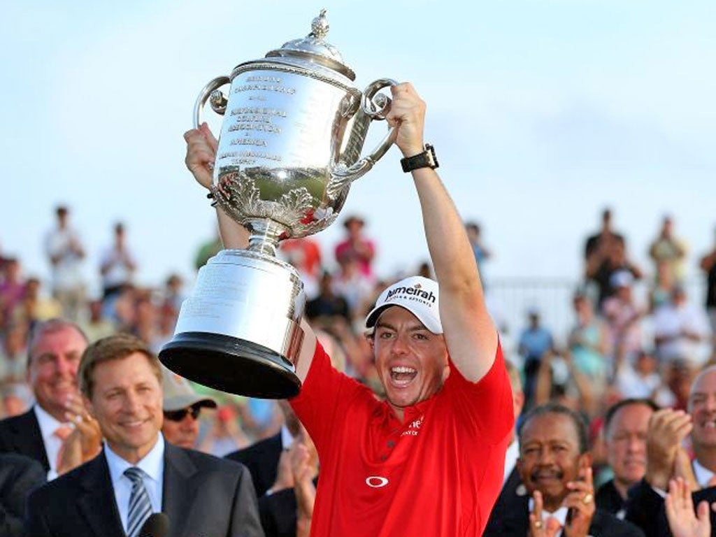 Rory McIlroy holds aloft the Wanamaker trophy on Sunday night