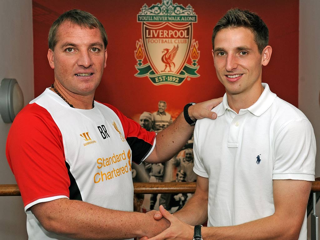 Joe Allen with Liverpool manager Brendan Rodgers